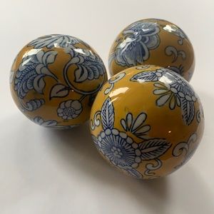 3 yellow glass/ ceramic balls with blue floral design